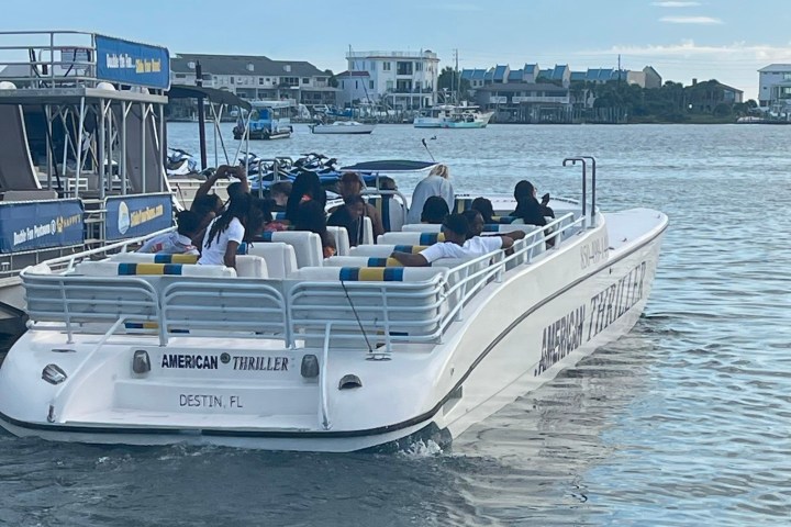 a group of people on a boat in the water